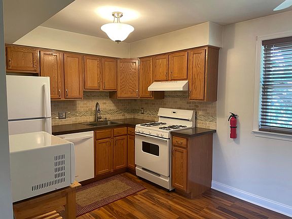 Kitchen featuring a dishwasher and microwave