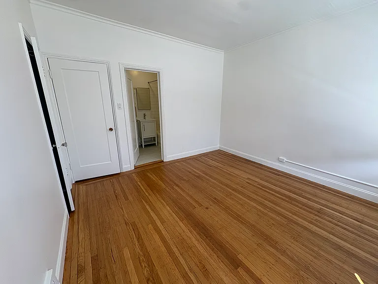 Bedroom has door to bathroom