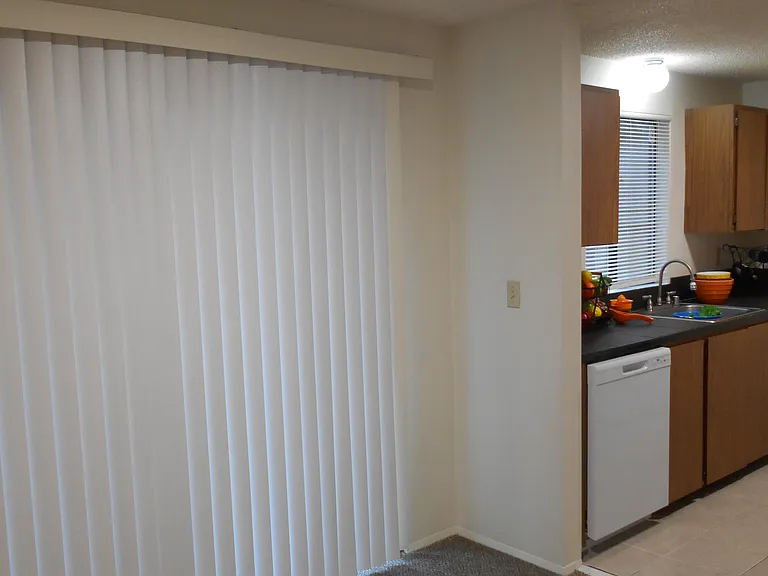 Dining area has a sliding glass door that leads to back patio and is adjacent to the kitchen.