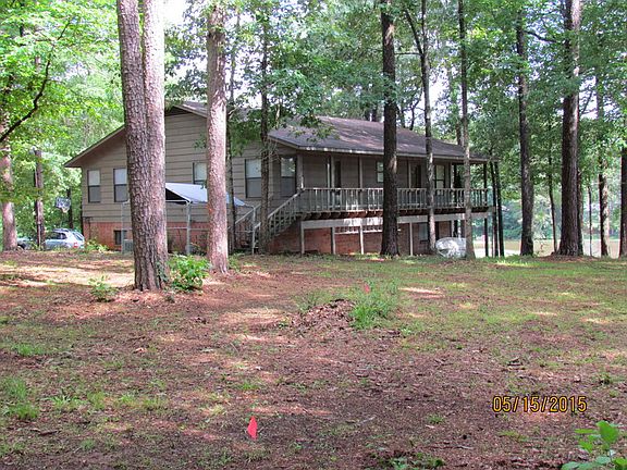 side view of home facing lake from road