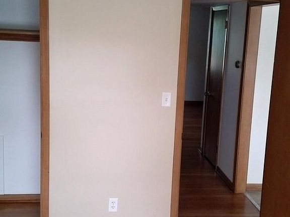In bedroom looking at closet and hallway