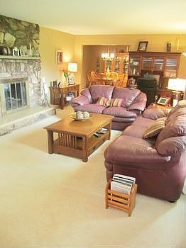 Spacious living room with newer gas log fireplace. The main floor also has fresh paint throughout.
