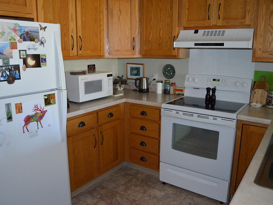Kitchen: glass-top stove and efficient fridge were new 9 months ago. Garbage disposal. Pull-out shelves in one cabinet.