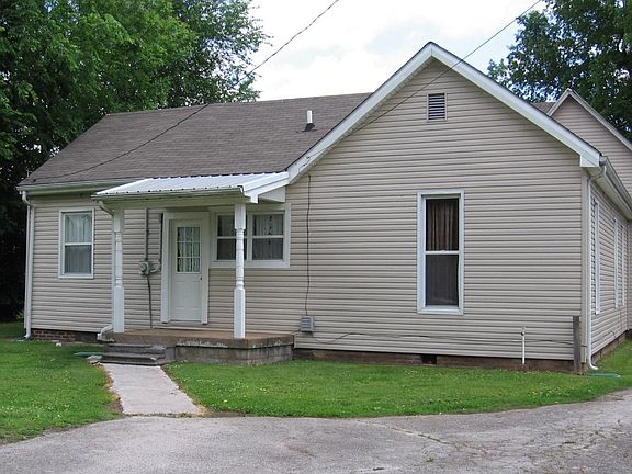 View of back of house.  Nice level yard.