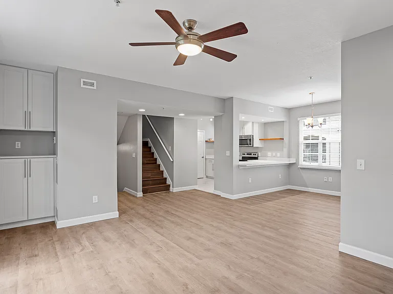 View of the dry bar, kitchen, bar, and dining room from the living room