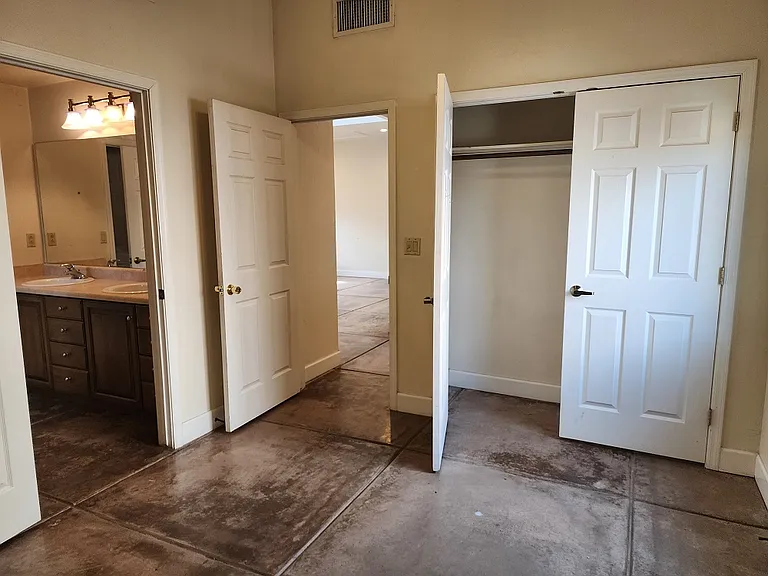 view from bedroom to bathroom, great room, closet