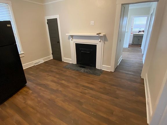 Living room with plank floors and wood ceilings