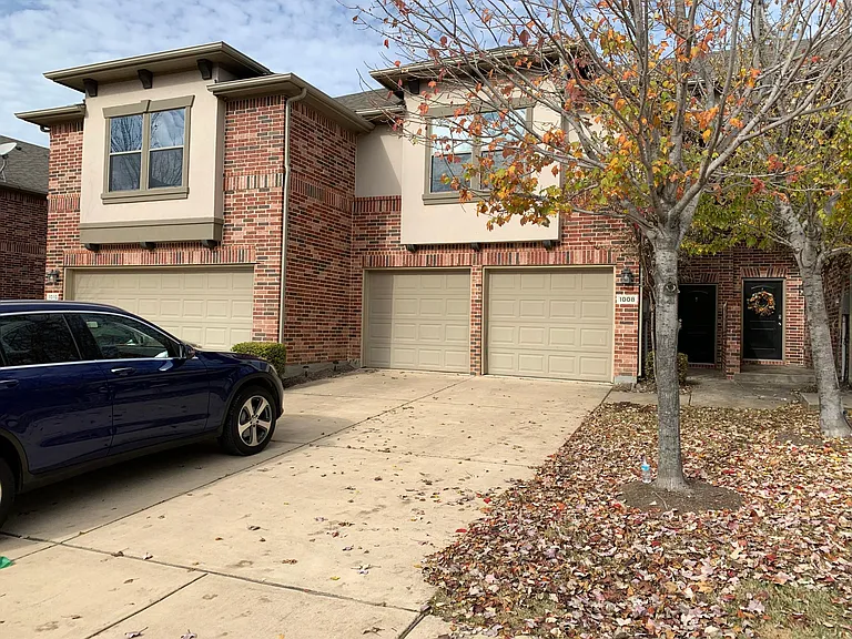 Spacious front porch that can easily fit 4 cars