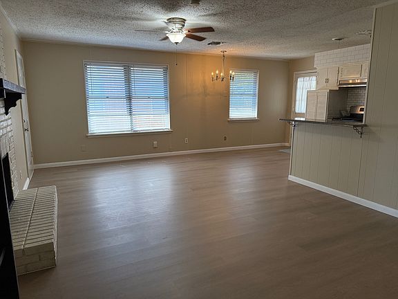 Living, dining and kitchen feature brand new luxury vinly planking floors.