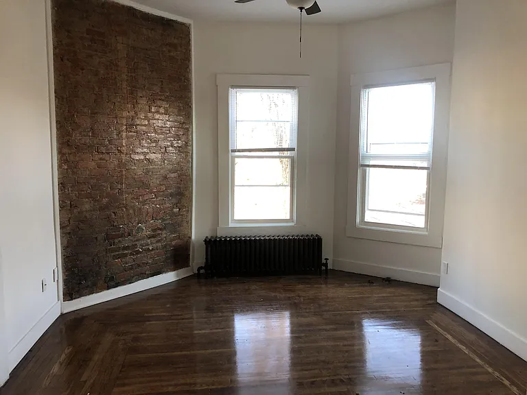 Living Room with Exposed brick