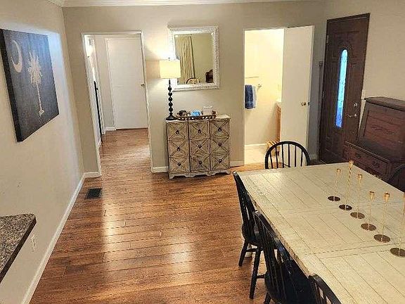 Dining area - half bath to the right - hallway to bedrooms and full bath to the left.