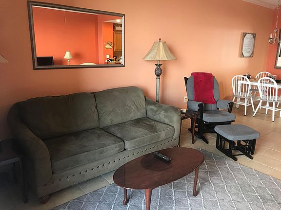 Living Room/Sleeper Sofa. Dutailier Rocker Glider. New area rug.