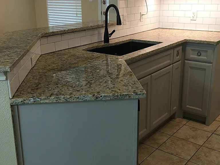 Kitchen with new cabinets, countertop, bar, sink, and faucet*