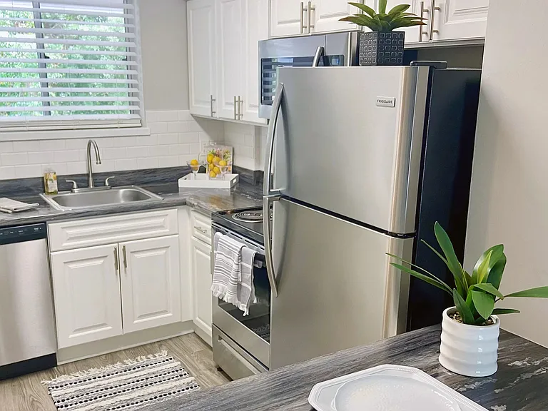 Delight in a cozy breakfast nook overlooking the dining and living area.