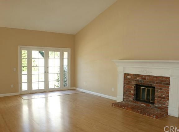 Living/ Family Room with Vaulted Ceilings and French Doors to Patio