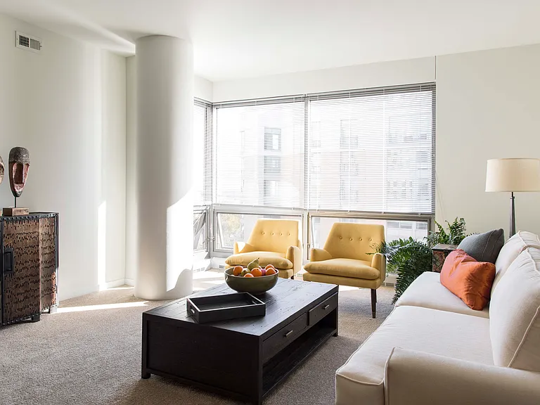 Floor-to-ceiling windows invite natural light into our designed living spaces, perfect for relaxation and entertaining.