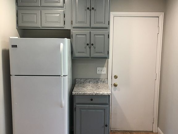Kitchen 2 (door pictured leads to basement and backyard)