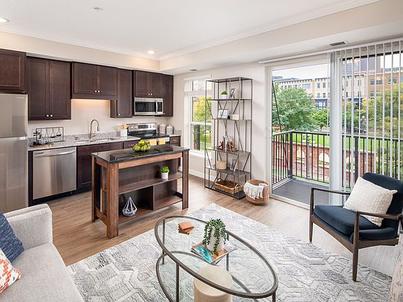 View of modern living room and kitchen area at The Whitley