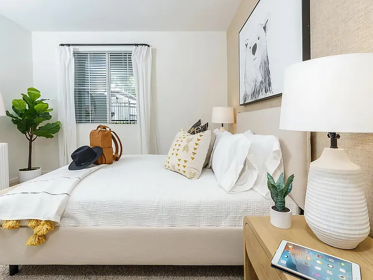 Oversized Bedroom with White Curtains and Natural Light
