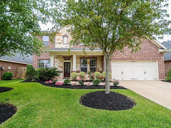 Beautiful David Weekley home in desirable Firethorne with lush landscape, upgraded brick & stone elevation with upgraded white mortar.