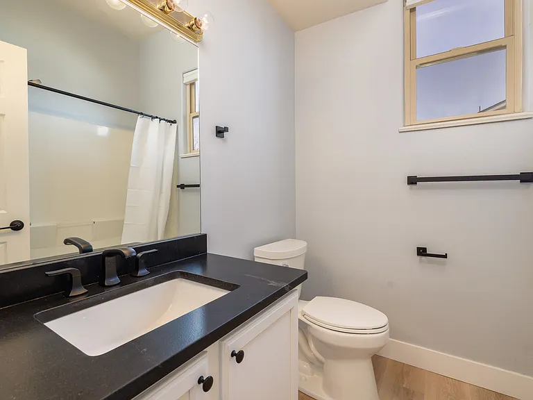 Right near bedroom #3 and kitchen