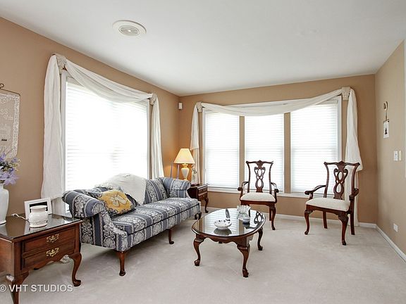 Spacious living room; silhouette window treatments