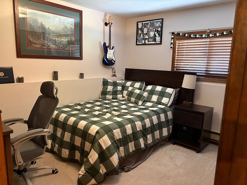 The room includes the bed, dresser and desk