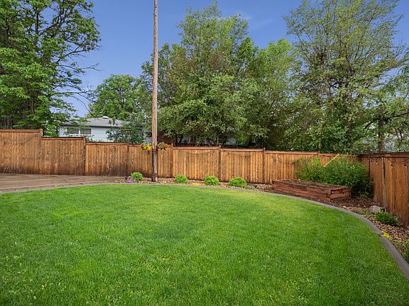 Cedar privacy fence surrounds the backyard.