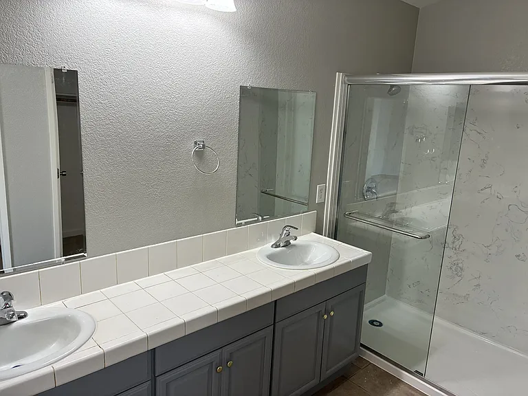 Master bath - dual sink. Brand new shower with marble panels. Brand new bathroom hardware, faucets and shower