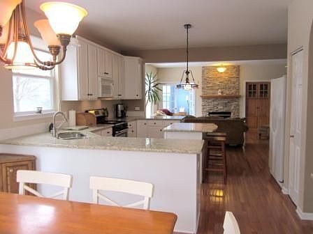 Large Kitchen with granite couters and hardwood floors