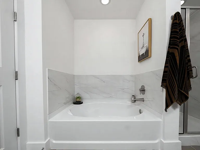 Spa-Inspired Bathroom with Deep Soaking Tub and Modern Fixtures