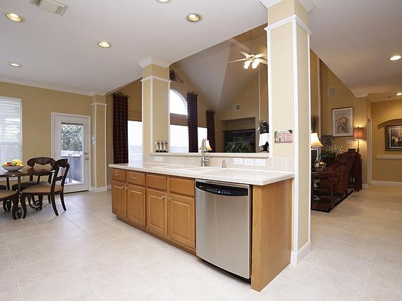 Kitchen is open to breakfast area and family room and enjoys access to the deck too.