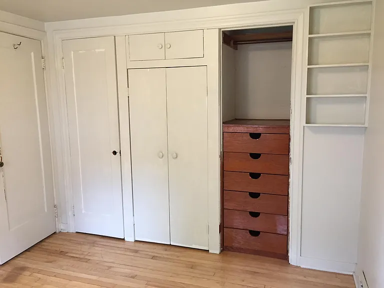Bedroom #2 with Built-in cabinets. Old photo, fresh paint shown in furnished photos.