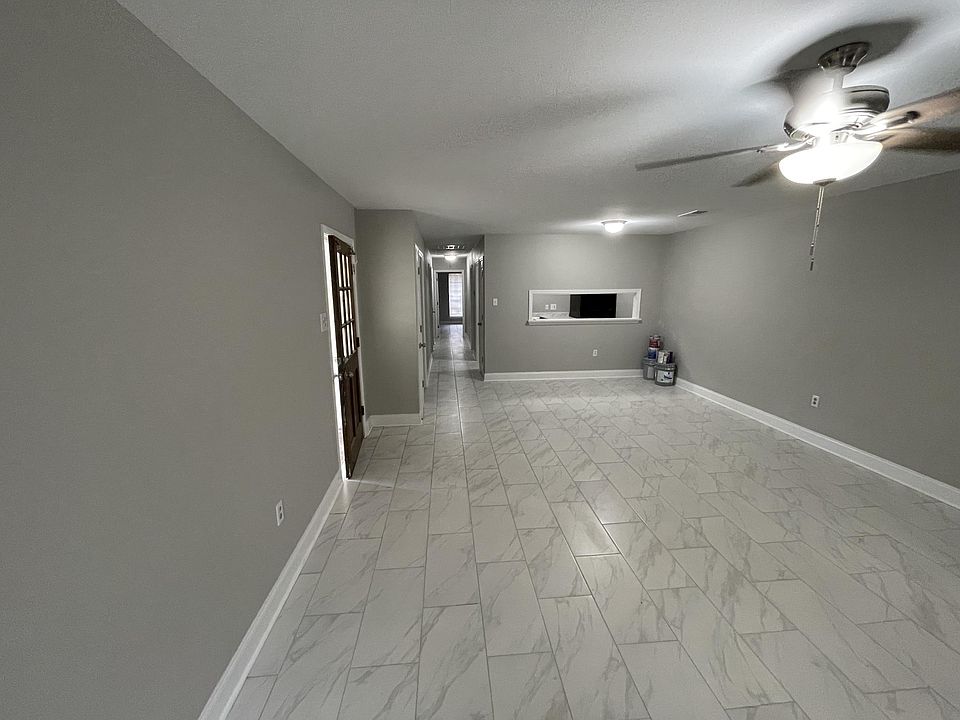 This is a picture of the unit next door, pictures for this unit will be uploaded after reno when finished. Same layout and similar floors but white walls