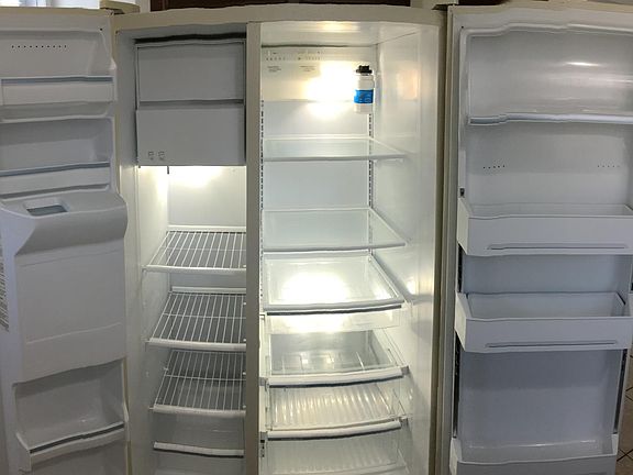Side-by-side refrigerator with ice-maker and water