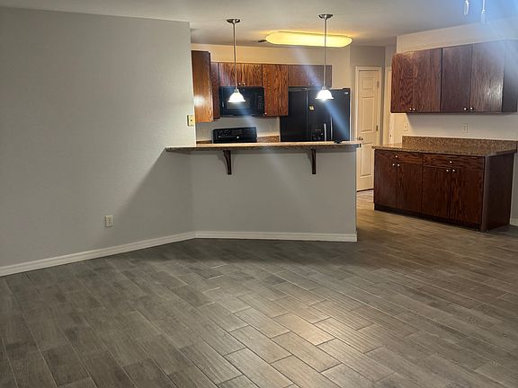 VIEW FROM LIVING AREA TO KITCHEN