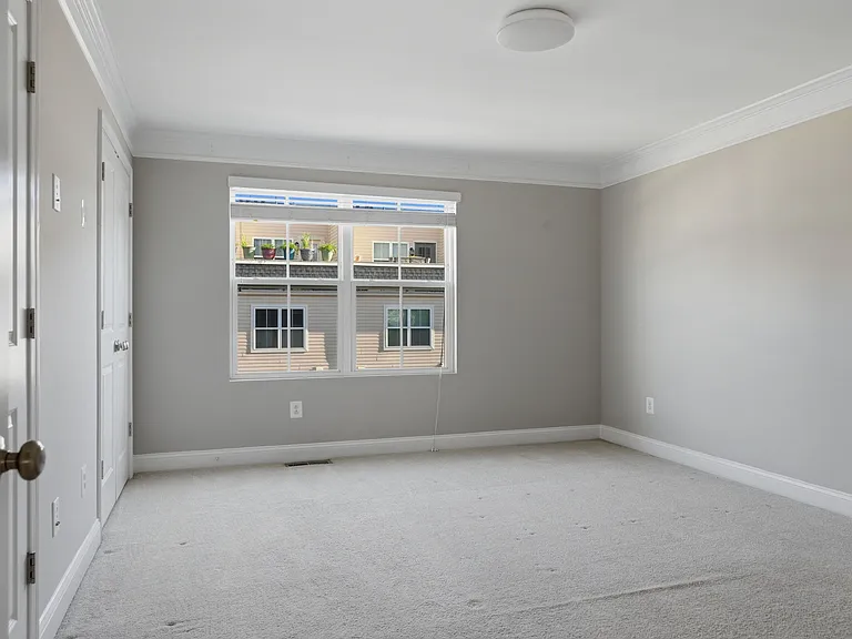 3rd-floor primary bedroom with two closets.