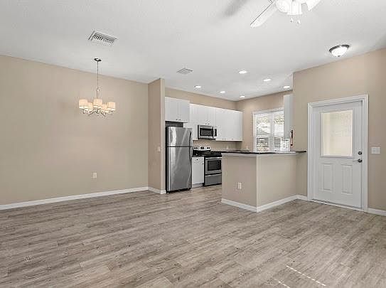 Open kitchen overlooking living room and dining area