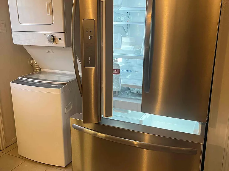double door fridge with icemaker. washer/dryer in unit