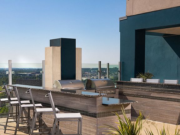 Built-in outdoor kitchen with BBQ grills