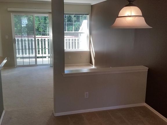 view of dining to living to deck