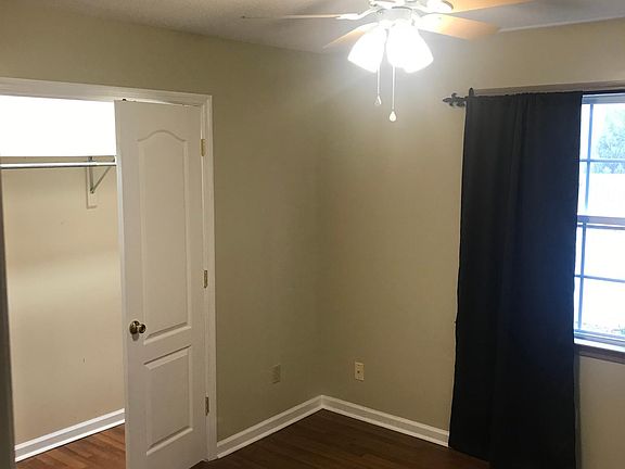 Entering the first bedroom. The closet is the full length of the room.
