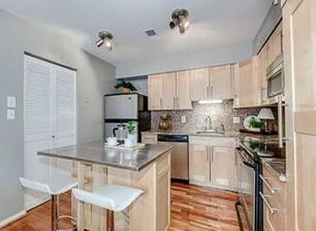 Updated kitchen with granite counter tops and island