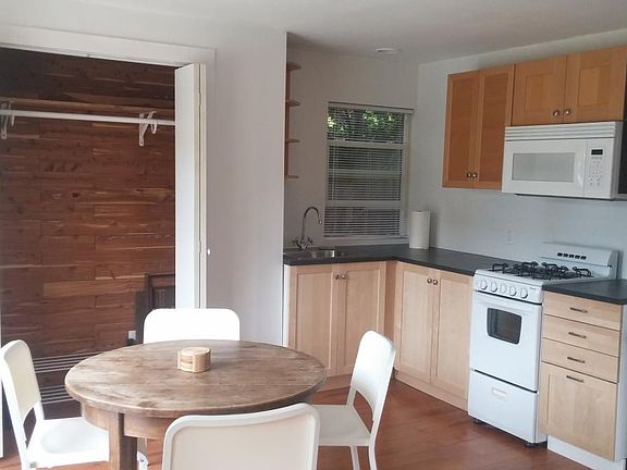 Dining nook, closet and kitchen
