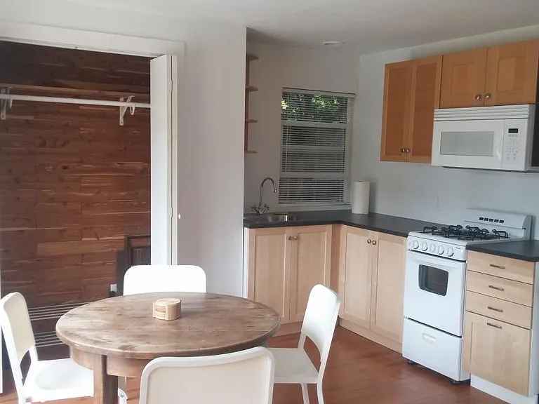 Dining nook, closet and kitchen