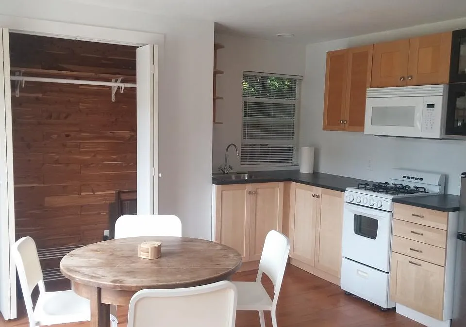 Dining nook, closet and kitchen