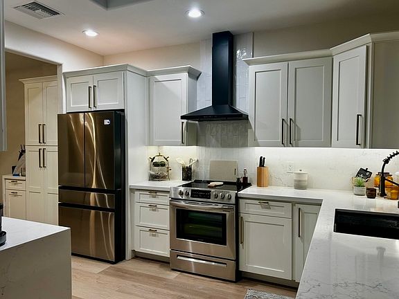 Gourmet kitchen with electric covered sky light, coffee and microwave station