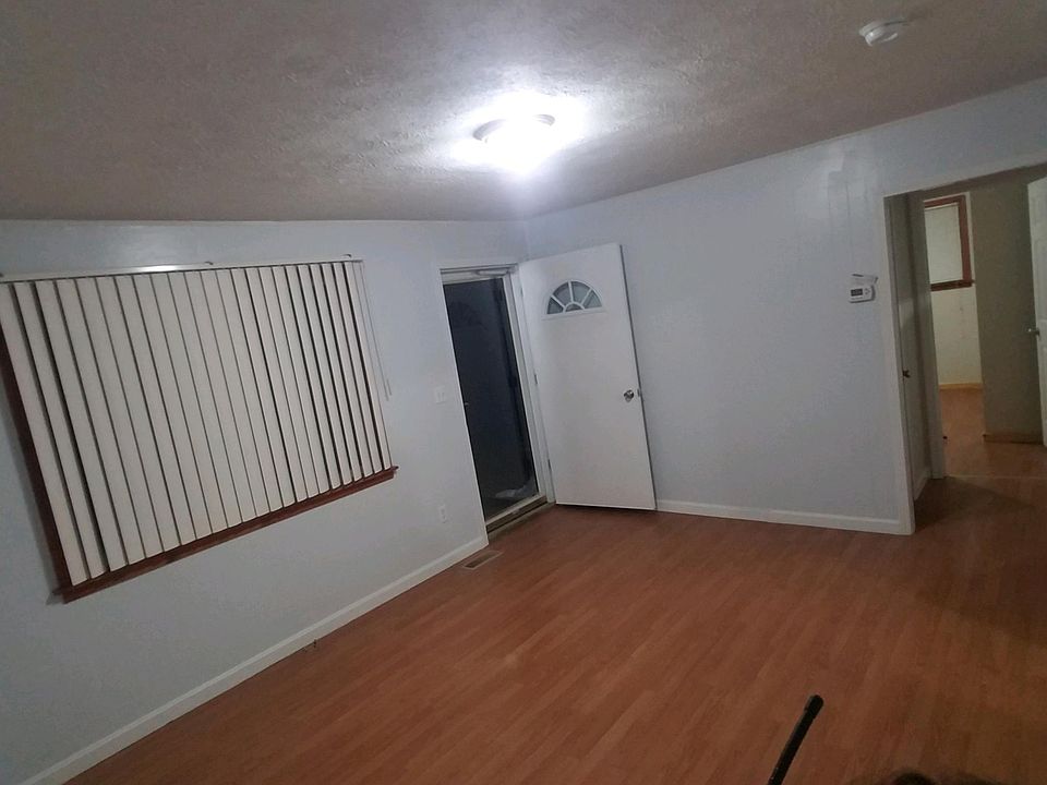 Living Room looking to front door and bedrooms