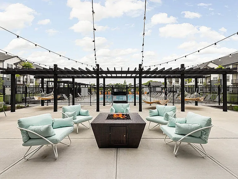 Outdoor Lounge Area Featuring Fireplace