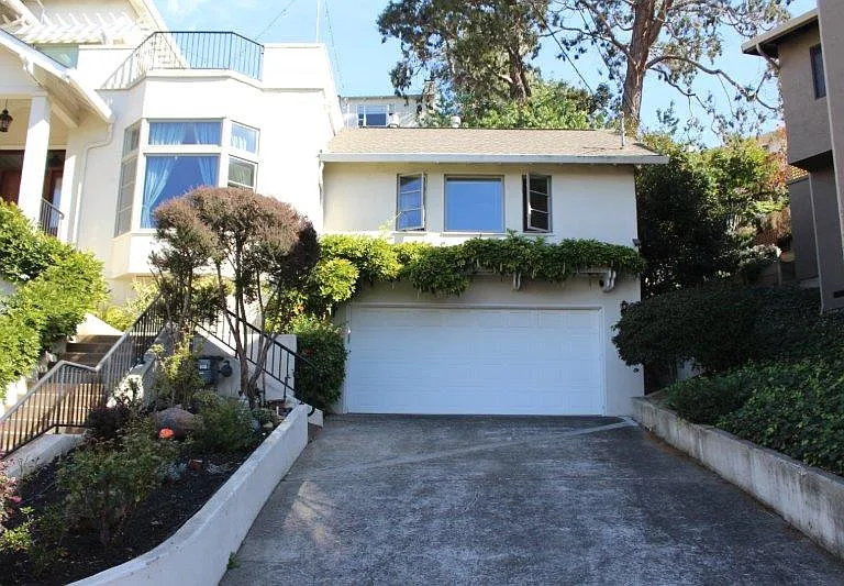 The unit is at the right side of the the house with its separate entrance.